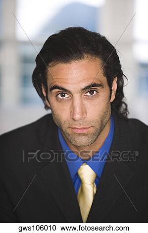 Portrait of a businessman looking serious View Large Photo Image Stock Image - Portrait of a businessman looking serious. Fotosearch