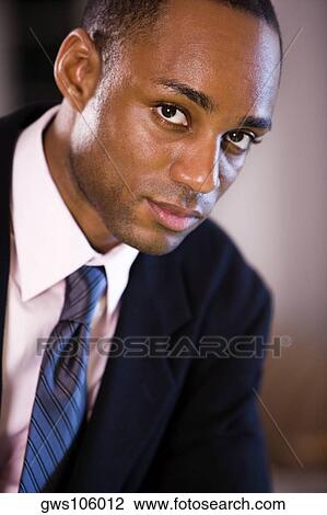 Portrait of a businessman looking serious View Large Photo Image Stock Image - Portrait of a businessman looking serious. Fotosearch
