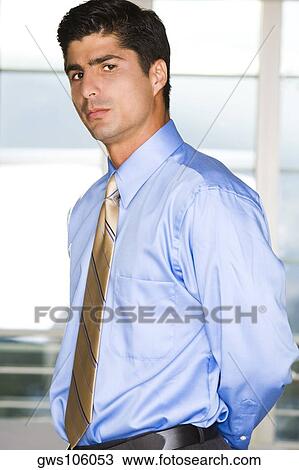 Portrait of a businessman looking serious View Large Photo Image Stock Image - Portrait of a businessman looking serious. Fotosearch