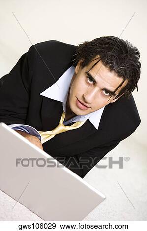 Portrait of a businessman smiling View Large Photo Image Stock Photo - Portrait of a businessman smiling. Fotosearch