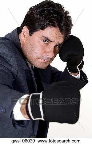 Portrait of a businessman wearing boxing gloves View Large Photo Image Stock Photo - Portrait of a businessman wearing boxing gloves. Fotosearch