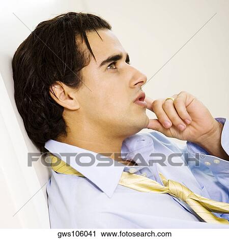 Side profile of a businessman looking away View Large Photo Image Stock Image - Side profile of a businessman looking away. Fotosearch