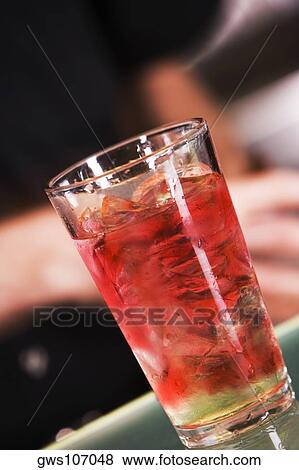 Close-up of a glass of cocktail View Large Photo Image Stock Photo - Close-up of a glass of cocktail. Fotosearch