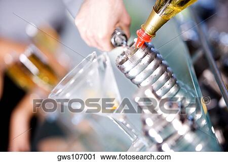 Close-up of a person's hand preparing a cocktail View Large Photo Image Stock Image - Close-up of a person's hand preparing a cocktail. Fotosearch