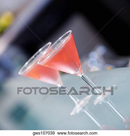 Close-up of two martini glasses View Large Photo Image Stock Photo - Close-up of two martini glasses. Fotosearch