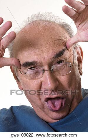 Close-up of a senior man making a face View Large Photo Image Stock Image - Close-up of a senior man making a face. Fotosearch