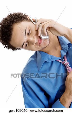 Close-up of a young man using a mobile phone View Large Photo Image Stock Image - Close-up of a young man using a mobile phone. Fotosearch