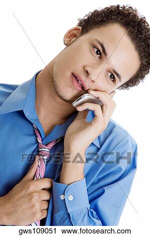 Close-up of a young man using a mobile phone View Large Photo Image Stock Image - Close-up of a young man using a mobile phone. Fotosearch