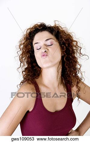 Close-up of a young woman making a face View Large Photo Image Stock Image - Close-up of a young woman making a face. Fotosearch