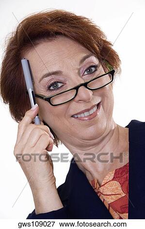 Stock Photo - Portrait of a businesswoman holding a pen. Fotosearch