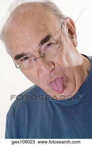Portrait of a senior man sticking out his tongue View Large Photo Image Stock Image - Portrait of a senior man sticking out his tongue. Fotosearch