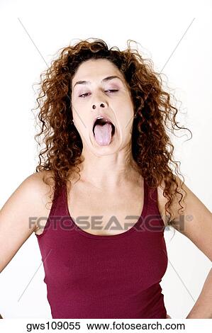 Young woman sticking out her tongue View Large Photo Image Stock Photography - Young woman sticking out her tongue. Fotosearch