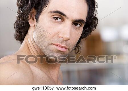 Close-up of a mid adult man looking serious View Large Photo Image Stock Photo - Close-up of a mid adult man looking serious. Fotosearch