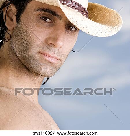 Portrait of a mid adult man wearing a hat View Large Photo Image Stock Photo - Portrait of a mid adult man wearing a hat. Fotosearch