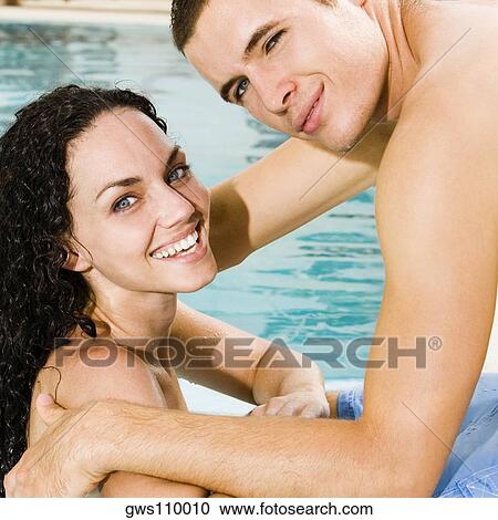 Portrait of a young couple in a swimming pool View Large Photo Image Stock Image - Portrait of a young couple in a swimming pool. Fotosearch