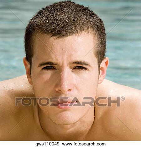 Portrait of a young man in a swimming pool View Large Photo Image Stock Photo - Portrait of a young man in a swimming pool. Fotosearch