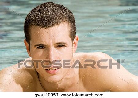 Portrait of a young man in a swimming pool View Large Photo Image Stock Photo - Portrait of a young man in a swimming pool. Fotosearch