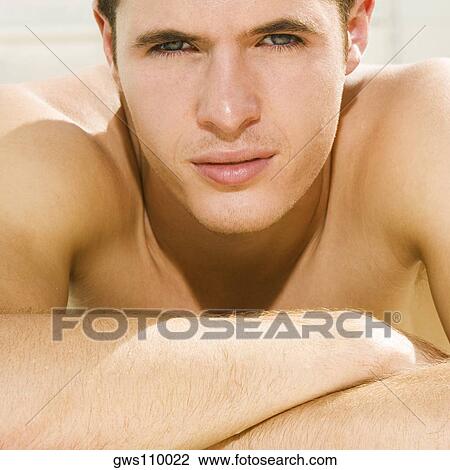 Portrait of a young man with his arms crossed View Large Photo Image Stock Image - Portrait of a young man with his arms crossed. Fotosearch