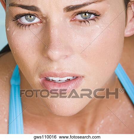 Portrait of a young woman looking serious View Large Photo Image Stock Photograph - Portrait of a young woman looking serious. Fotosearch