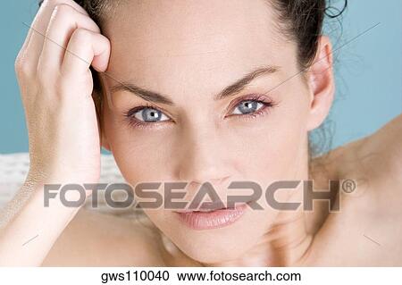 Portrait of a young woman sitting at the poolside View Large Photo Image Stock Image - Portrait of a young woman sitting at the poolside. Fotosearch