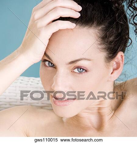 Portrait of a young woman sitting at the poolside View Large Photo Image Stock Photography - Portrait of a young woman sitting at the poolside. Fotosearch