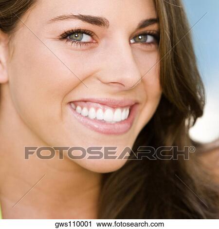 Portrait of a young woman smiling View Large Photo Image Stock Image - Portrait of a young woman smiling. Fotosearch