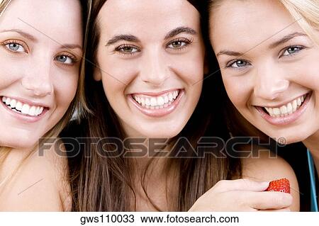 Portrait of three young women smiling View Large Photo Image Stock Image - Portrait of three young women smiling. Fotosearch