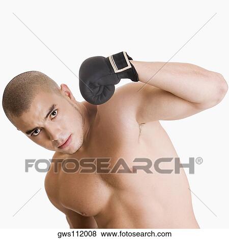 Portrait of a young man hitting himself View Large Photo Image Stock Photo - Portrait of a young man hitting himself. Fotosearch