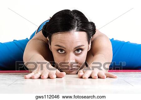 Portrait of a young woman performing yoga View Large Photo Image Stock Photograph - Portrait of a young woman performing yoga. Fotosearch