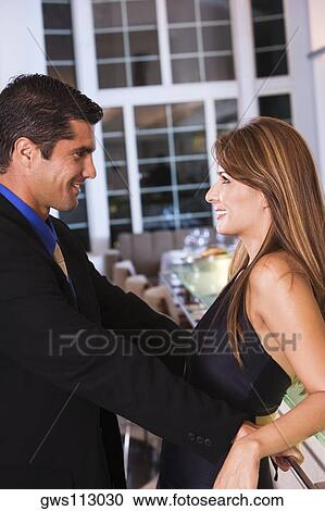 Side profile of a mid adult couple looking at each other View Large Photo Image Stock Image - Side profile of a mid adult couple looking at each other. Fotosearch