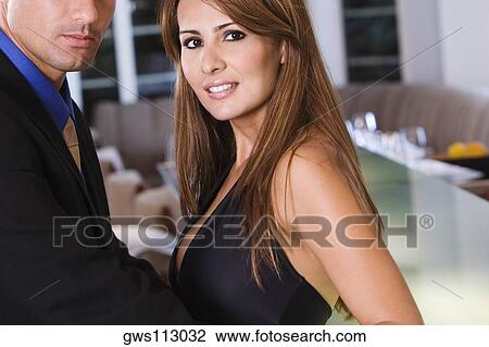 Side profile of a mid adult couple View Large Photo Image Stock Image - Side profile of a mid adult couple. Fotosearch