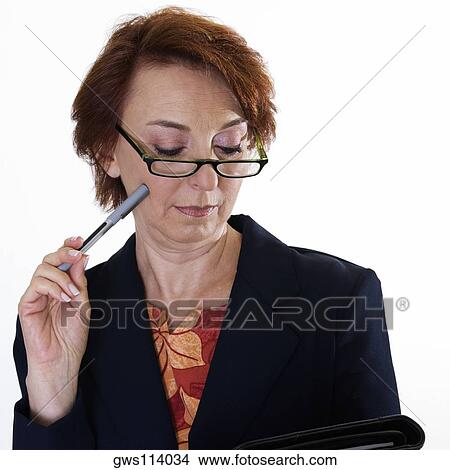 Close-up of a businesswoman holding a file View Large Photo Image Picture - Close-up of a businesswoman holding a file. Fotosearch