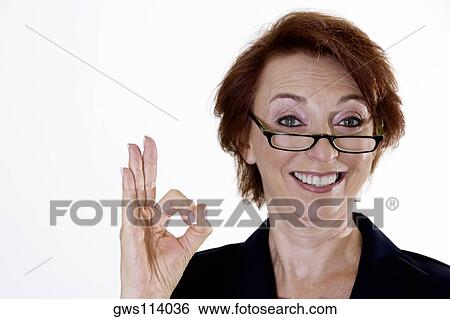 Portrait of a businesswoman showing an ok sign View Large Photo Image Stock Photograph - Portrait of a businesswoman showing an ok sign. Fotosearch