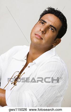 Close-up of a mid adult man looking up View Large Photo Image Stock Photograph - Close-up of a mid adult man looking up. Fotosearch