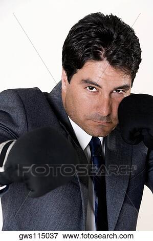Portrait of a businessman wearing boxing gloves View Large Photo Image Stock Photo - Portrait of a businessman wearing boxing gloves. Fotosearch