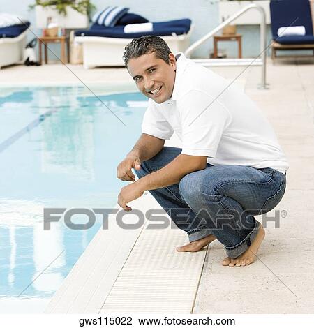 Stock Image - Portrait of a mid adult man smiling. Fotosearch