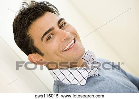 Stock Photography - Portrait of a mid adult man smiling. Fotosearch