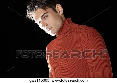 Portrait of a young man looking serious View Large Photo Image Stock Photography - Portrait of a young man looking serious. Fotosearch