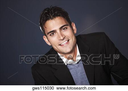 Portrait of a young man smiling View Large Photo Image Stock Image - Portrait of a young man smiling. Fotosearch