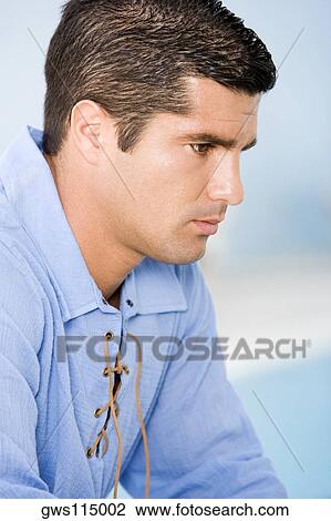 Side profile of a mid adult man looking serious View Large Photo Image Stock Image - Side profile of a mid adult man looking serious. Fotosearch