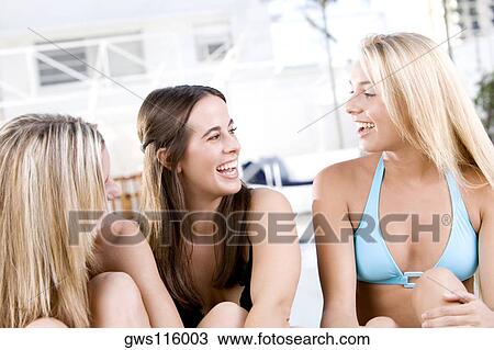 Close-up of three young women laughing View Large Photo Image Stock Image - Close-up of three young women laughing. Fotosearch
