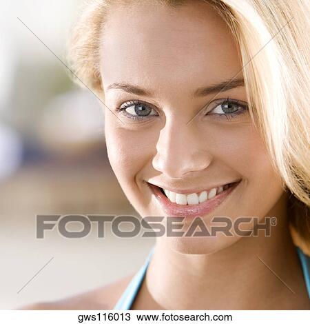 Portrait of a young woman smiling View Large Photo Image Stock Image - Portrait of a young woman smiling. Fotosearch