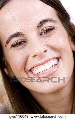 Portrait of a young woman smiling View Large Photo Image Stock Photo - Portrait of a young woman smiling. Fotosearch
