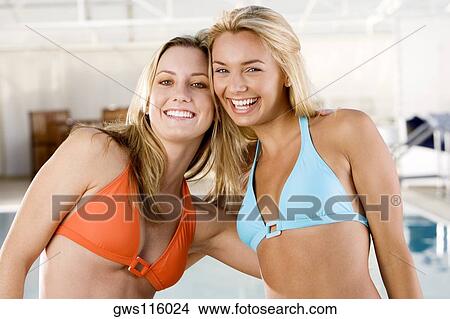 Portrait of two young women smiling View Large Photo Image Picture - Portrait of two young women smiling. Fotosearch