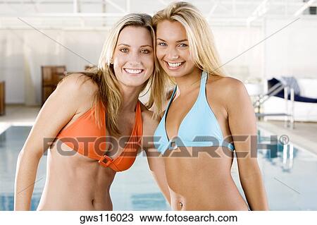 Portrait of two young women smiling View Large Photo Image Stock Image - Portrait of two young women smiling. Fotosearch