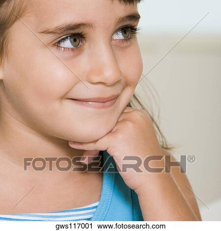 Stock Image - Close-up of a girl smiling. Fotosearch