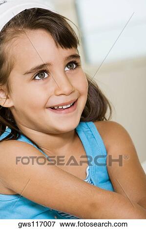 Stock Photo - Close-up of a girl smiling. Fotosearch