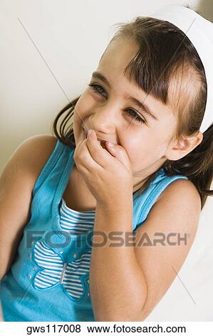 Close-up of a girl smiling View Large Photo Image Stock Photo - Close-up of a girl smiling. Fotosearch