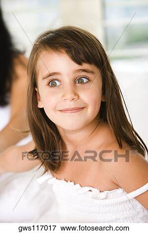 Stock Photo - Close-up of a girl smiling. Fotosearch