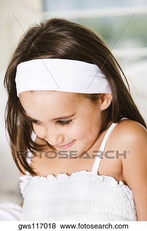 Stock Photo - Close-up of a girl smiling. Fotosearch